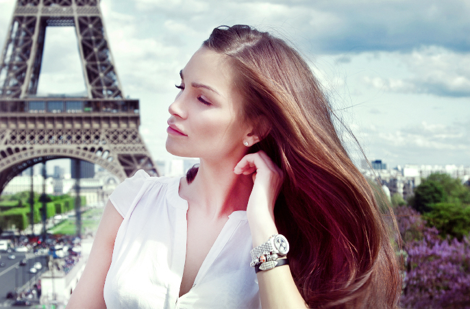 Beautiful woman in Paris near the Eiffel tower